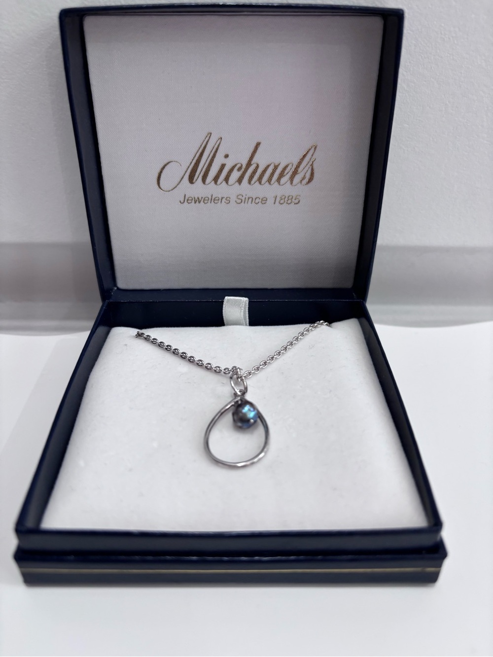 Michaels Silver Teardrop Necklace with Iridescent Blue Accent